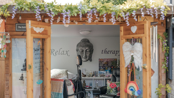 Relaxtherapy garden studio open door and massage chair