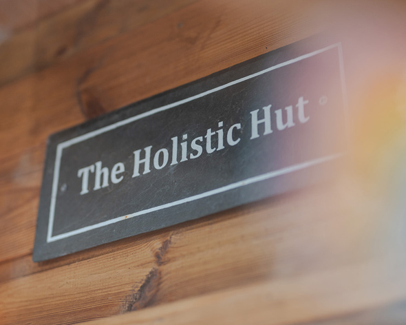 The Holistic Hut slate sign