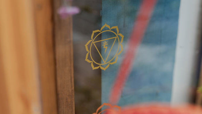 Chakra symbol on glass panel