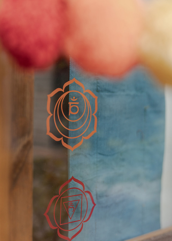 Chakra symbol on glass window panel