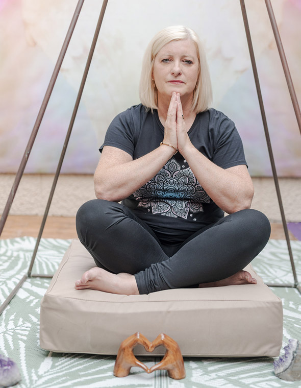 Caroline Evans, owner of Relaxtherapy, meditating