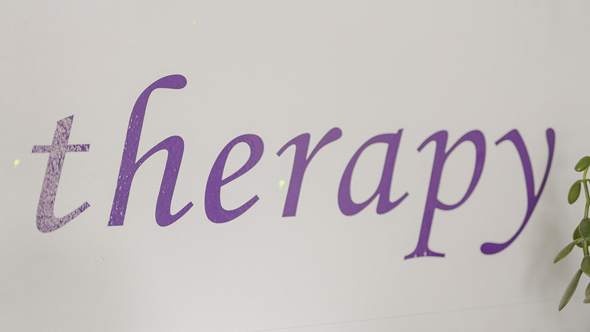 therapy vinyl sign on wall in Relaxtherapy garden studio